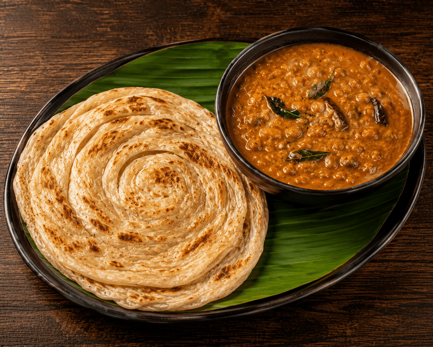 Menu Parotta & Curry de Lentilles - Parotta traditionnel accompagné d’un curry de lentilles parfumé aux épices.